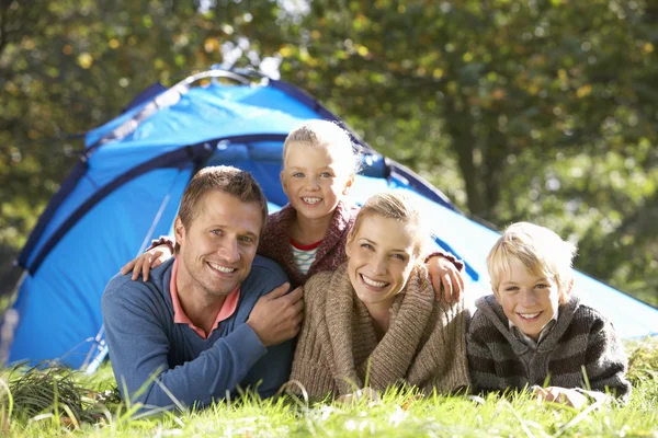Young family poses outside of tent — Stock Photo, Image