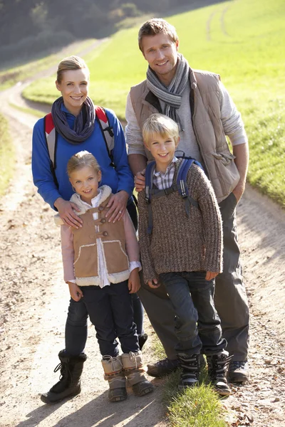 Young family posing in park — Stock Photo, Image
