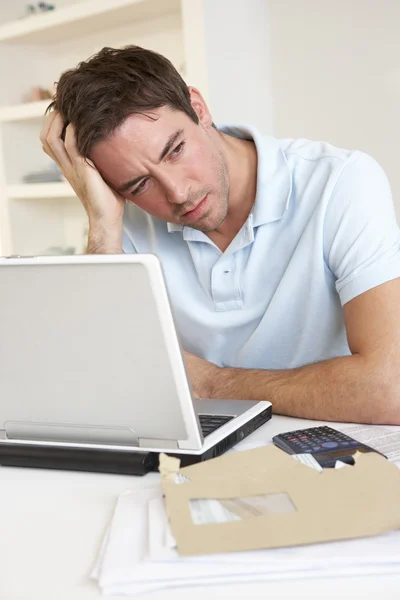 Young man working with laptop computer — Stock Photo, Image