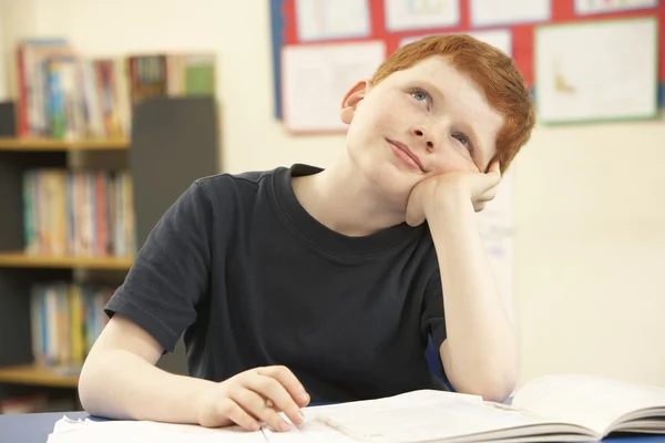 Schoolboy Daydreaming In Classroom — Stock Photo, Image