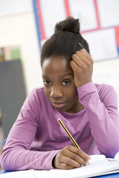 Stressed Schoolgirl Studying In Classroom — Stock Photo, Image