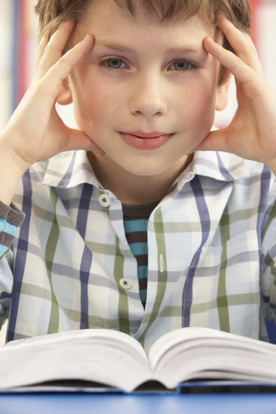 Stressed Schoolboy Studying In Classroom — Stock Photo, Image