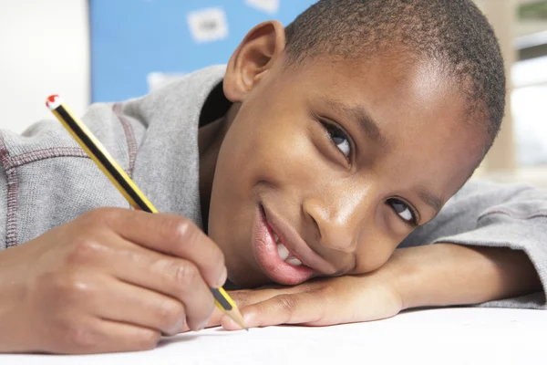 Schoolboy Studying In Classroom Royalty Free Stock Photos