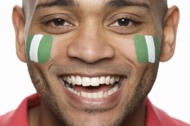 Young Male Sports Fan With Nigerian Flag Painted On Face clipart