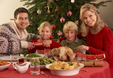 Family Enjoying Christmas Meal At Home clipart