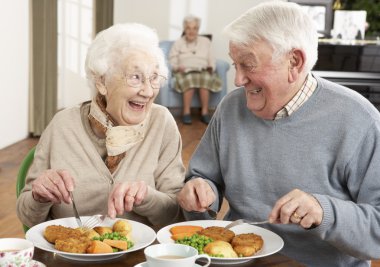 Senior Couple Enjoying Meal Together clipart