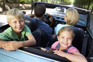 Family in sports car clipart