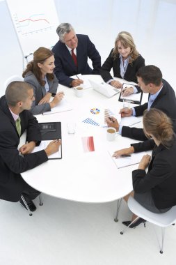Mixed group in business meeting clipart