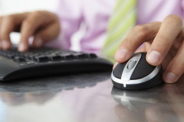 Close up man using keyboard and mouse clipart