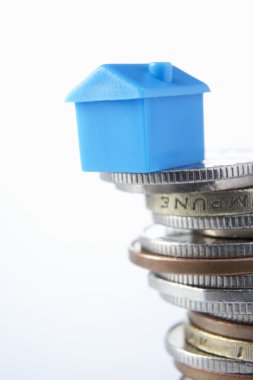 Small model house and coins clipart