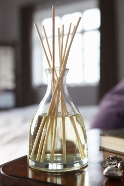 Incense sticks on bedside table clipart