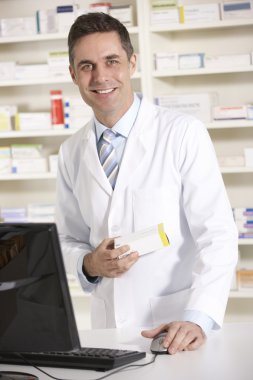 American pharmacist working on computer clipart