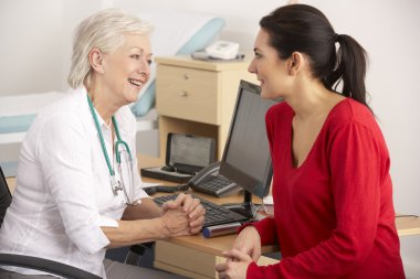 British GP talking to woman patient clipart