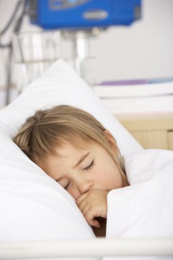 Young girl asleep in Accident and Emergency bed clipart