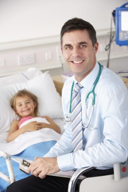 Doctor with child patient in UK Accident and Emergency clipart