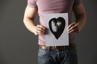 Man holding ink drawing of heart clipart