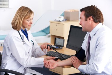 American doctor taking patient's blood pressure clipart