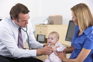 Mother and baby in doctor's surgery clipart