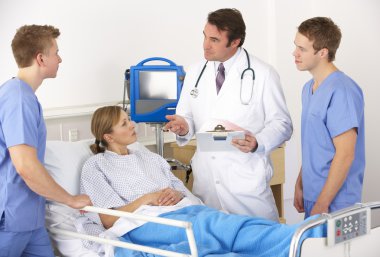 American medical team by patient's bed clipart