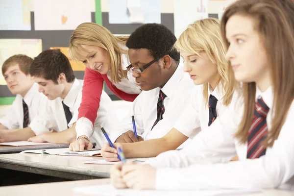 Teenage Students Studying In Classroom With Teacher — Stock Photo, Image