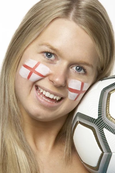 Jonge vrouwelijke voetbalfan met st georges vlag geschilderd op gezicht — Stockfoto