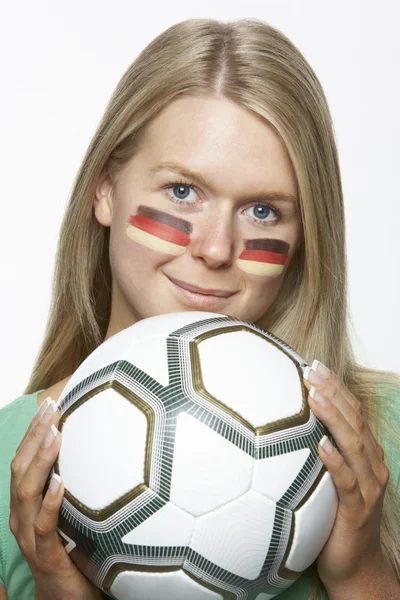 Ventilador deportivo femenino joven con bandera alemana pintada en la cara —  Fotos de Stock
