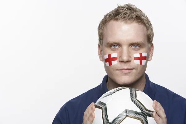 Ventilador de fútbol masculino joven con bandera de St Georges pintada en la cara —  Fotos de Stock