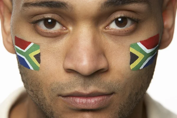 Teleurgesteld jonge mannelijke sportenventilator met Zuid-Afrikaanse vlag verf — Stockfoto