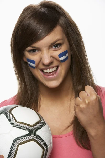 年轻女性足球迷与洪都拉斯国旗画在脸上 — 图库照片