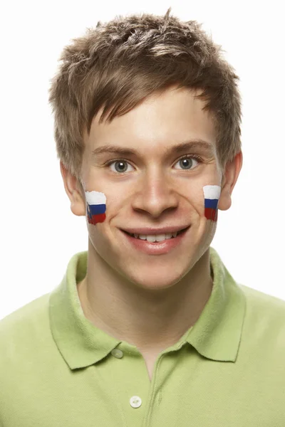 Вентилятор юношеских видов спорта со словацким флагом, раскрашенным на лице — стоковое фото