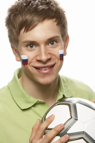 年轻男子足球风扇与斯洛伐克国旗画在脸上 — 图库照片