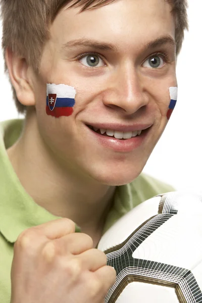 Giovane tifoso di calcio maschile con bandiera slovacca dipinta sul viso — Foto Stock