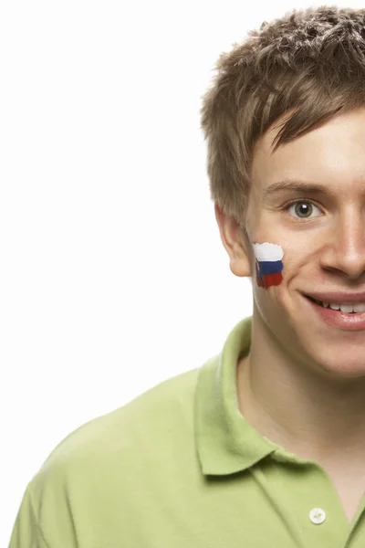 Вентилятор юношеских видов спорта со словацким флагом, раскрашенным на лице — стоковое фото