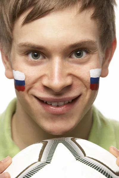 Unga manliga fotbollsfan med slovakiska flagga målade ansiktet — Stockfoto