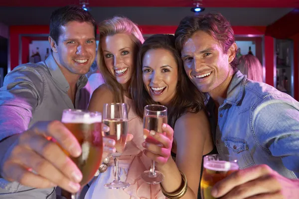 Group Of Young Having Fun In Busy Bar — Stock Photo, Image