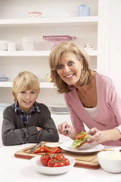 Grandmother And Grandson Making Sandwich In Kitchen — Stock Photo, Image