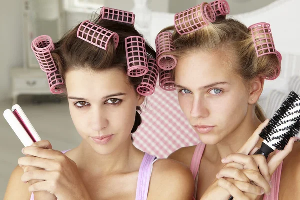 Teenage girls with hair in curlers — Stock Photo, Image