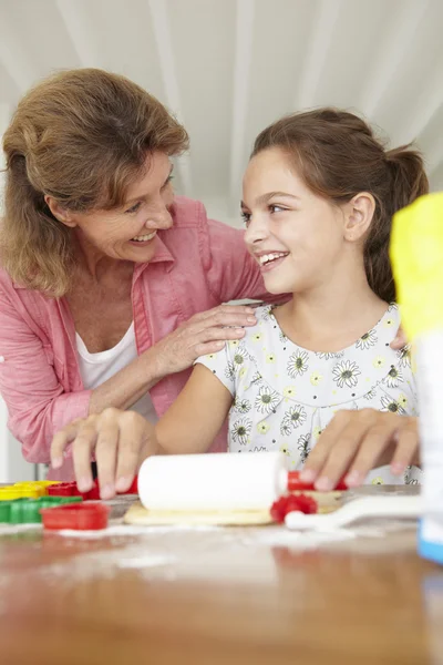 Young girl baking with grandmother — Stock Photo, Image