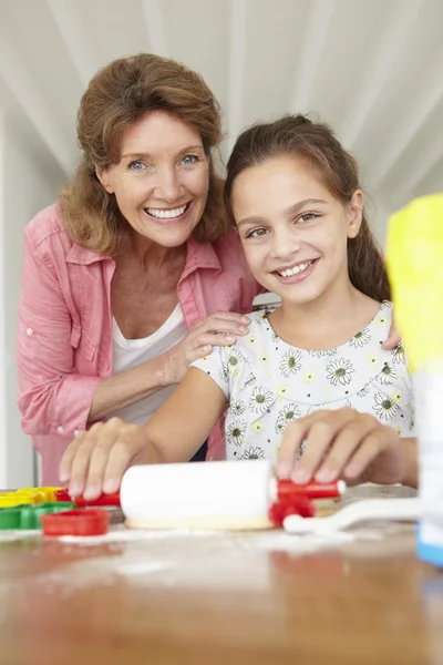 Young girl baking with grandmother — Stock Photo, Image