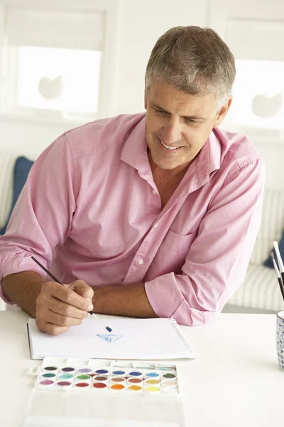 Mid age man painting with watercolors — Stock Photo, Image