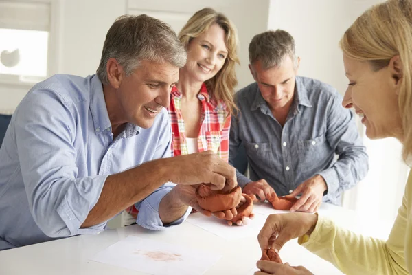 Mid age couples clay modelling — Stock Photo, Image