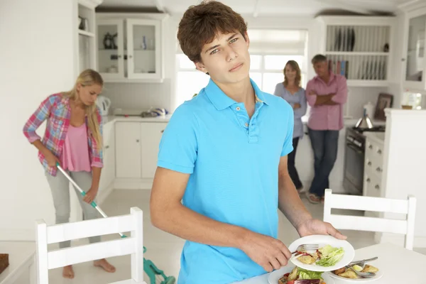 Teenagers reluctantly doing housework — Stock Photo, Image