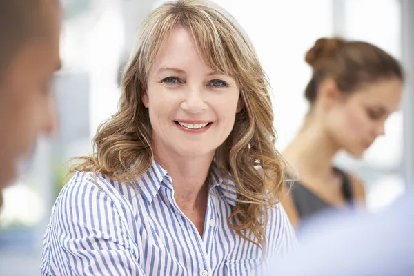Mid age businesswoman in meeting — Stock Photo, Image