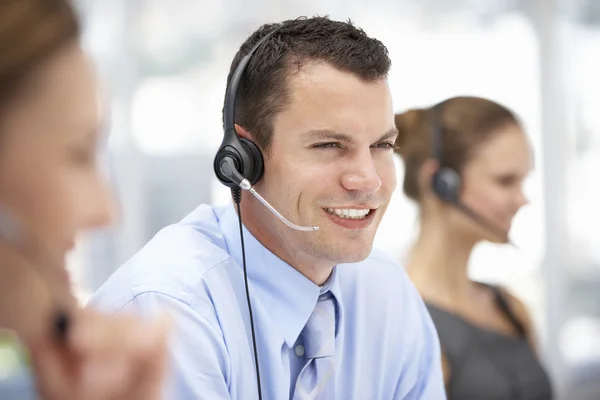 Young businessman wearing headset — Stock Photo, Image