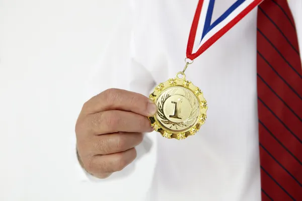 Businessman wearing medal — Stock Photo, Image