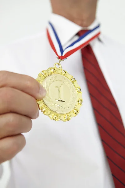 Businessman wearing medal — Stock Photo, Image