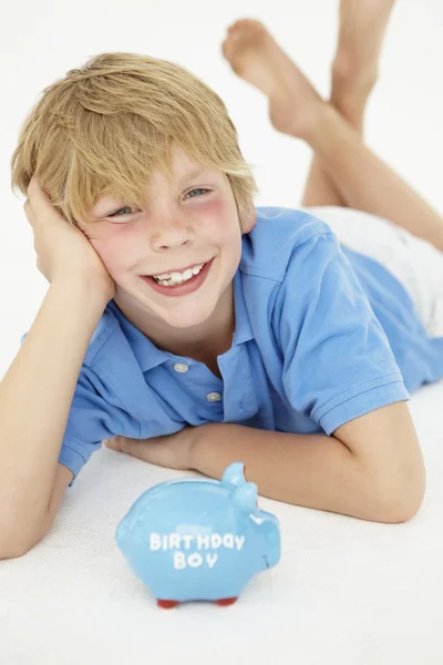 Young boy with piggy bank — Stock Photo, Image