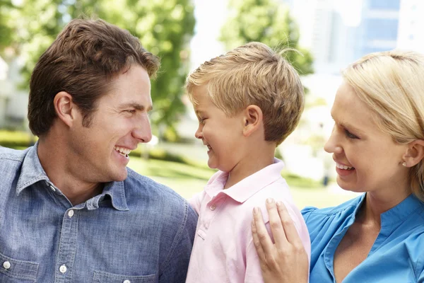 Couple in city park with young son — Stock Photo, Image