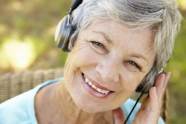 Senior woman with headphone — Stock Photo, Image