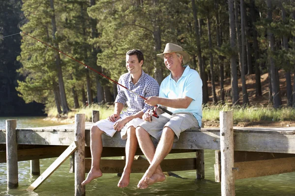 Father and adult son fishing together — Stock Photo, Image